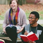 Antioch College students discuss a book together