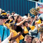 Allegheny College students cheer at a football game