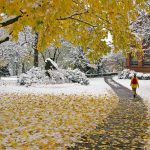 Allegheny College student walks across campus during a snowfall