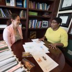 A student and professor meet together
