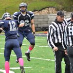 The Lawrence University football team celebrates a great play