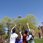 Students play frisbee on Flunk Day at Knox College.
