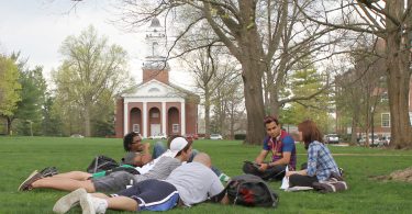Wabash College students hang out on the campus lawn