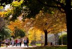 Goucher College students walk across campus on a fall day