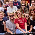 Students cheering on the Ursinus football team at a home game