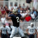 Juniata's quarterback throws a pass