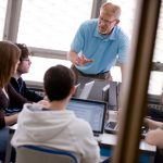 A Juniata College professor speaks with students in class