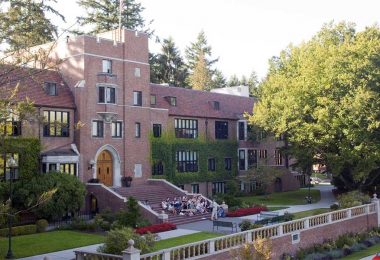 University of Puget Sound student gather in front of a campus building together