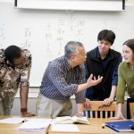 A Reed College professor talks with students