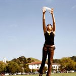 A Saint Mary's College student catches a disc on campus