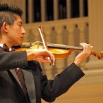 A Wheaton College student plays the violin