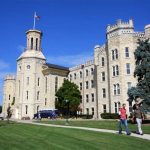 Wheaton College students walk across campus on a spring day