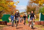 Allegheny College students ride bikes across campus