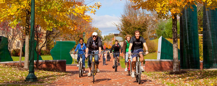 Allegheny College students ride bikes across campus
