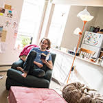 A Beloit student relaxing in his dorm room