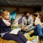 Cornell College students hang out in a residence hall room