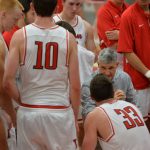 Basketball coach mentors his team