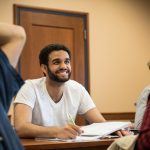 Student smiles in the classroom
