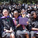 Agnes Scott students showing off diplomas for Commencement 2018.