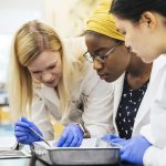 Agnes Scott College professor and students during Neuroscience Lab experiment.