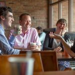 Earlham College students and professors meet over coffee