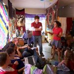 Hendrix students visit together in a residence hall room.