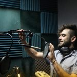 Hampshire College student in a sound booth