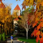 Whitman College students walk across campus on an autumn day