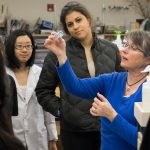 Whitman College students work with their professor in a science lab