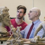 Hillsdale College students and faculty work together on a sculpture