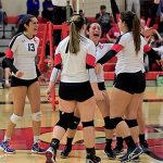 The Clark women’s volleyball team celebrate after a point