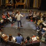 Clark theater students on statge, in a circle