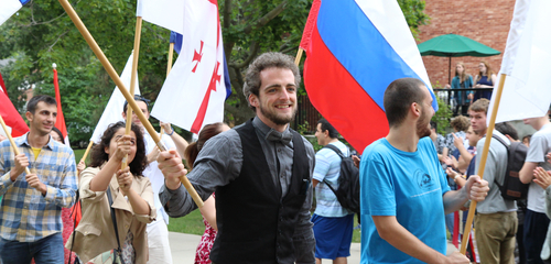 Beloit College students carry the international flags of their home countries.