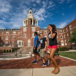 Students walk past Stuyvesant Hall, Ohio Wesleyan University