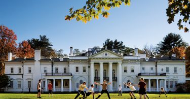 Students play Ultimate on campus in front of Blithewood Manor, which is home to the Levy Economic Institute at Bard.