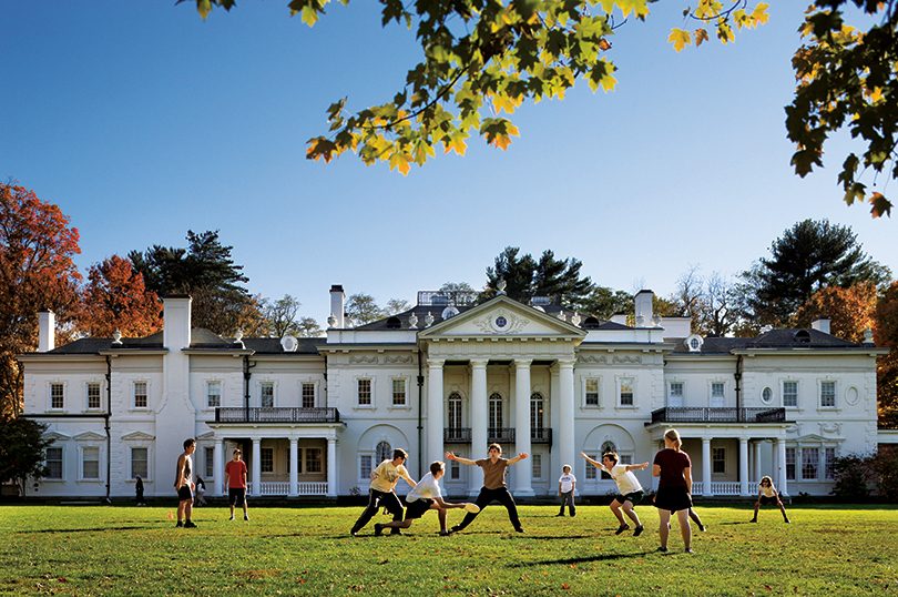 Students play Ultimate on campus in front of Blithewood Manor, which is home to the Levy Economic Institute at Bard.