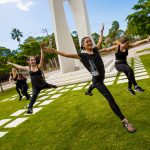 Dance students perform outdoors around the New College Bell Tower