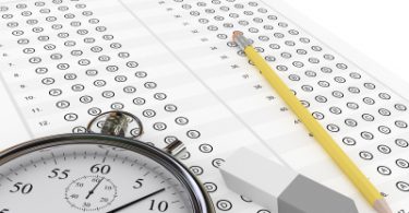 A test booklet, pencil, eraser, and stopwatch