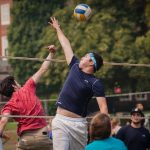 students play volleyball
