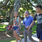 Madeline Vargo '20 and Jonathan Sakai '21 stroll through Hough Quad with Nazarré Merchant, Associate Professor of Mathematics
