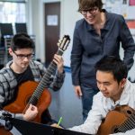 A Guilford College Music professor collaborates with two guitar majors at Dana Auditorium.