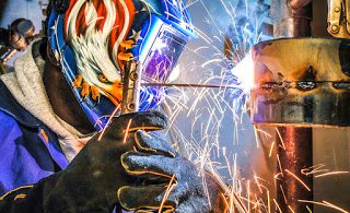 a stick welder in use