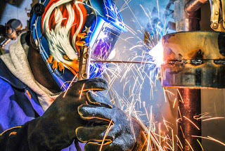 a stick welder in use